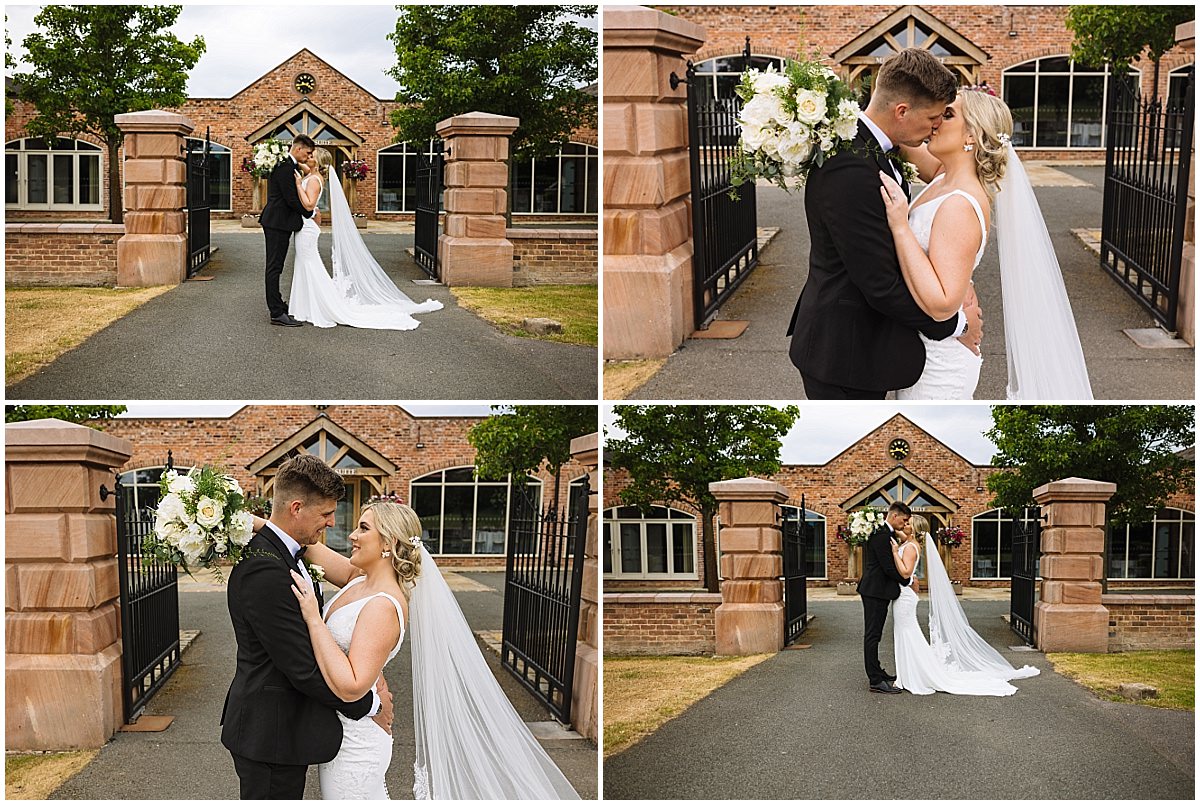 A bride and groom share a romantic kiss in a picturesque setting, framed by elegant architecture and lush greenery, showcasing their love and joy on their special day.